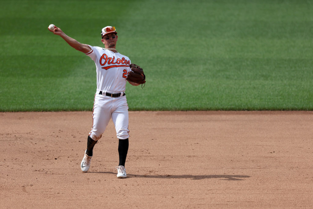 Ramón Urías throwing in white